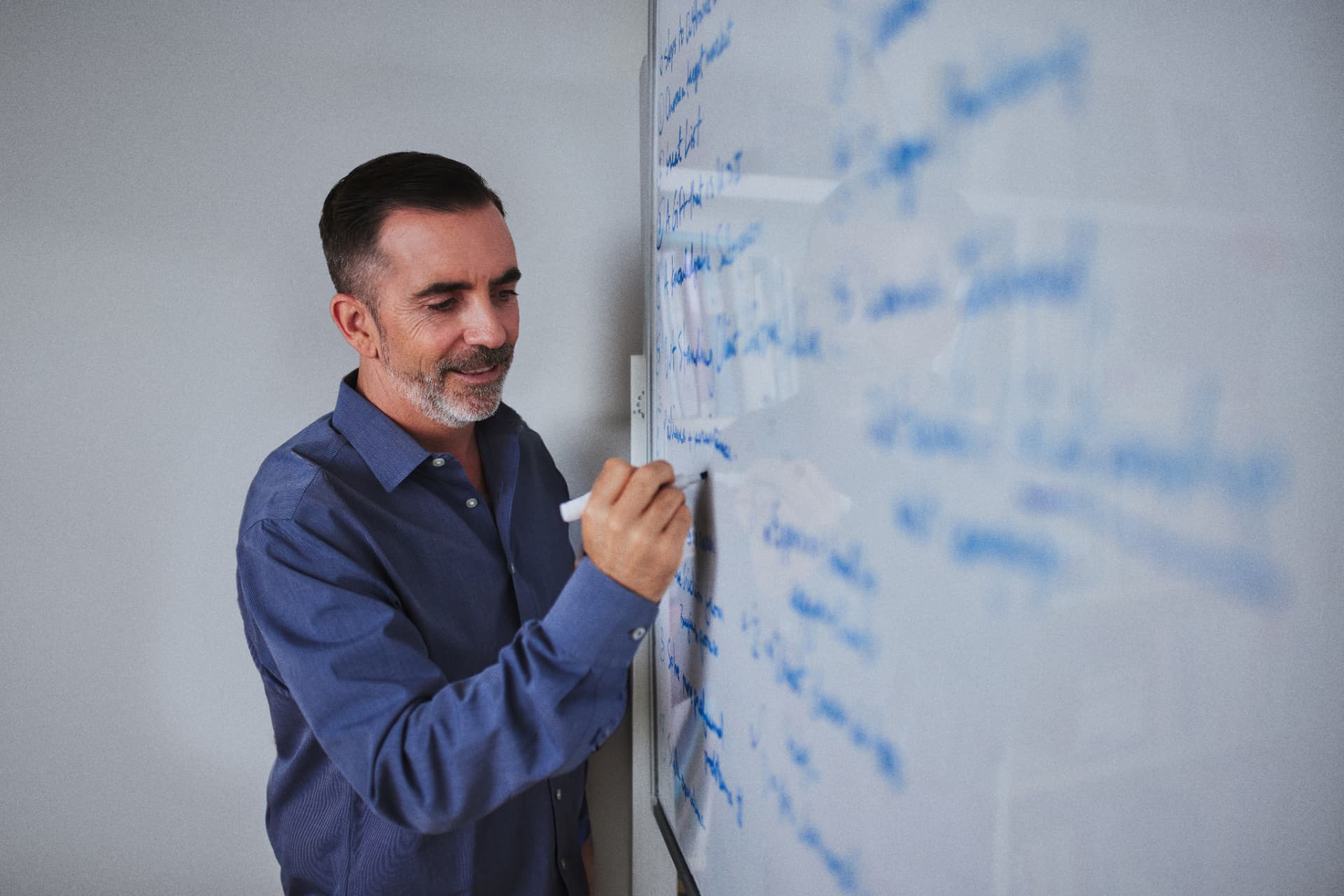 Corey Quinn mapping an agency growth strategy on a whiteboard